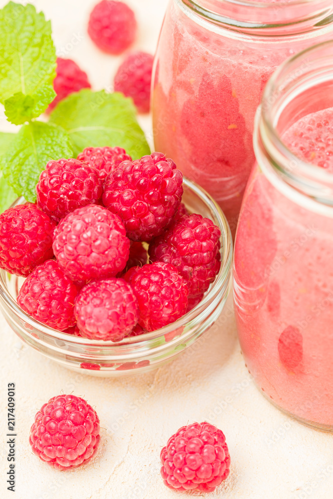 Raspberry smoothie close up photography with fresh summer blended cocktail and ripe berries. Raspberry smoothie close up photography with fresh summer blended cocktail and ripe berries.