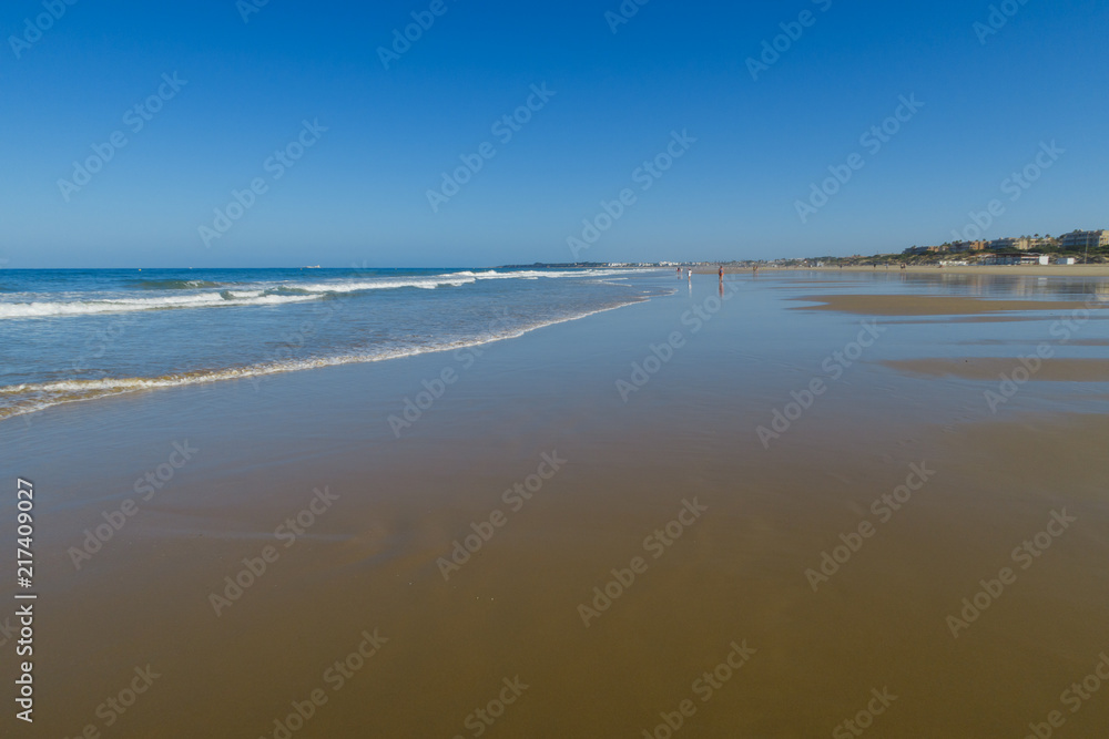 Barrosa beach in Sancti Petri, Spain, at low tide