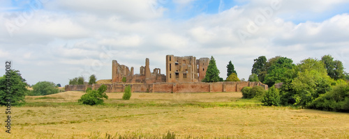 A panorama of the Kenilworth castle standing on a low hill, which was located in the heart of a 1,600 hectare park and is surrounded by a large artificial lake.