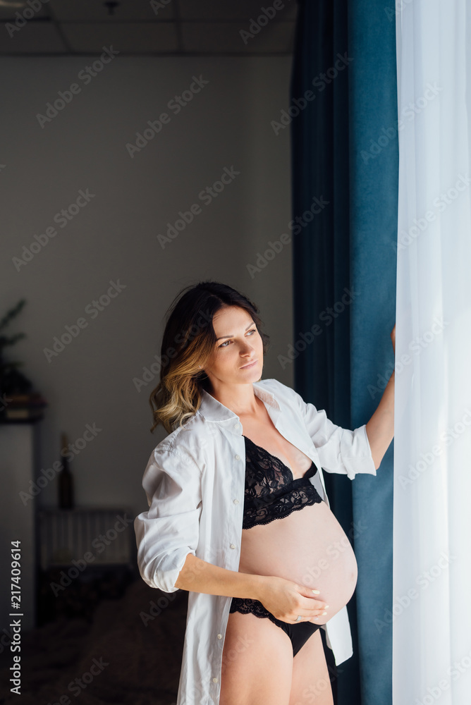 Stylish future young mother in anticipation of the meaning of life