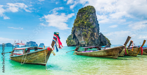 Amazing view of beautiful beach with longtale boats. Location: Railay beach, Krabi, Thailand, Andaman Sea. Artistic picture. Beauty world. Panorama © olenatur