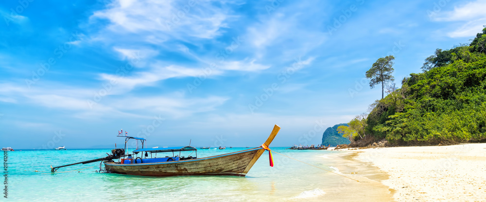 Naklejka premium Amazing view of beautiful beach with traditional thailand longtale boat. Location: Bamboo island, Krabi province, Thailand, Andaman Sea. Artistic picture. Beauty world. Panorama