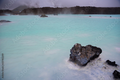 The Blue Lagoon geothermal spa and lava rocks in Iceland.