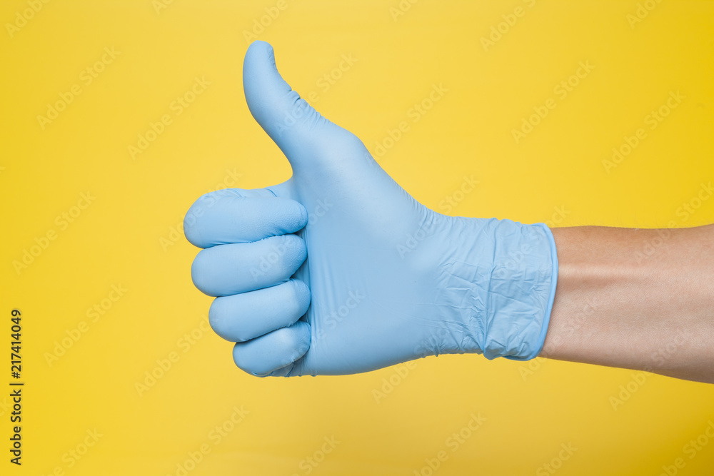 Doctor Wearing Blue Latex Glove Giving Thumbs Up Sign