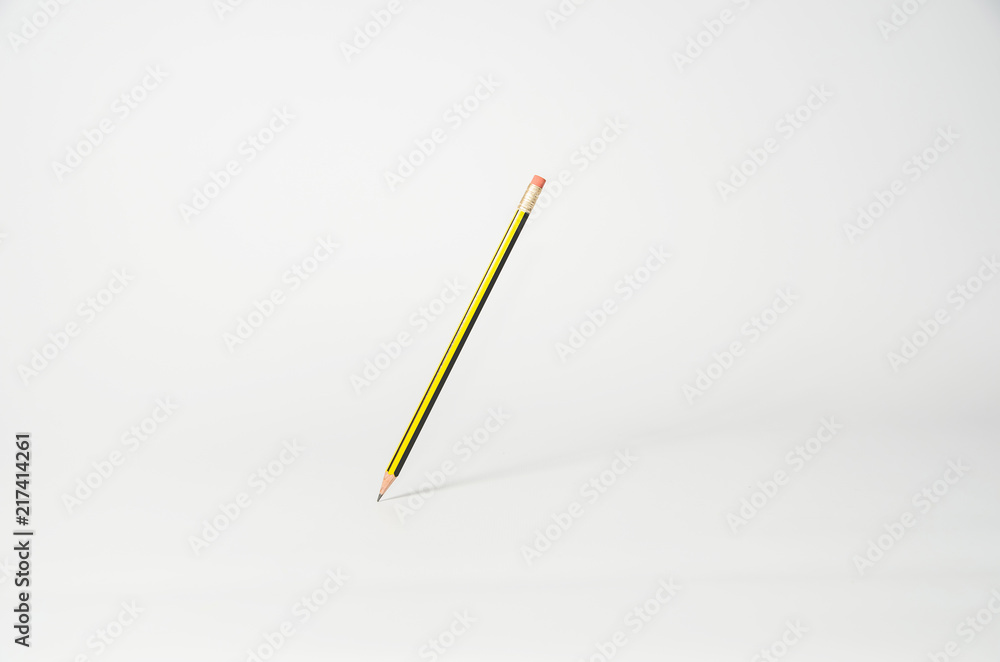 Pencil hanging in the air on a light background Pencil hanging in the air on a light background