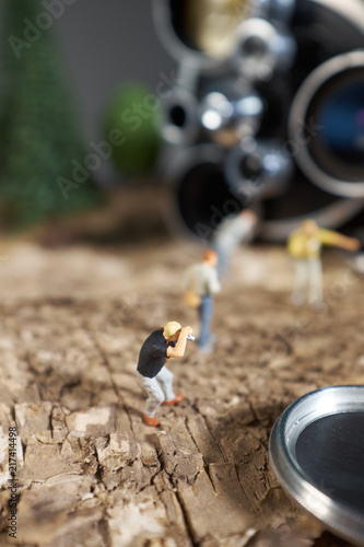 Wallpaper Mural Miniature people photograpehr : shooting  a Retro, old, vintage and classic film camera Torontodigital.ca