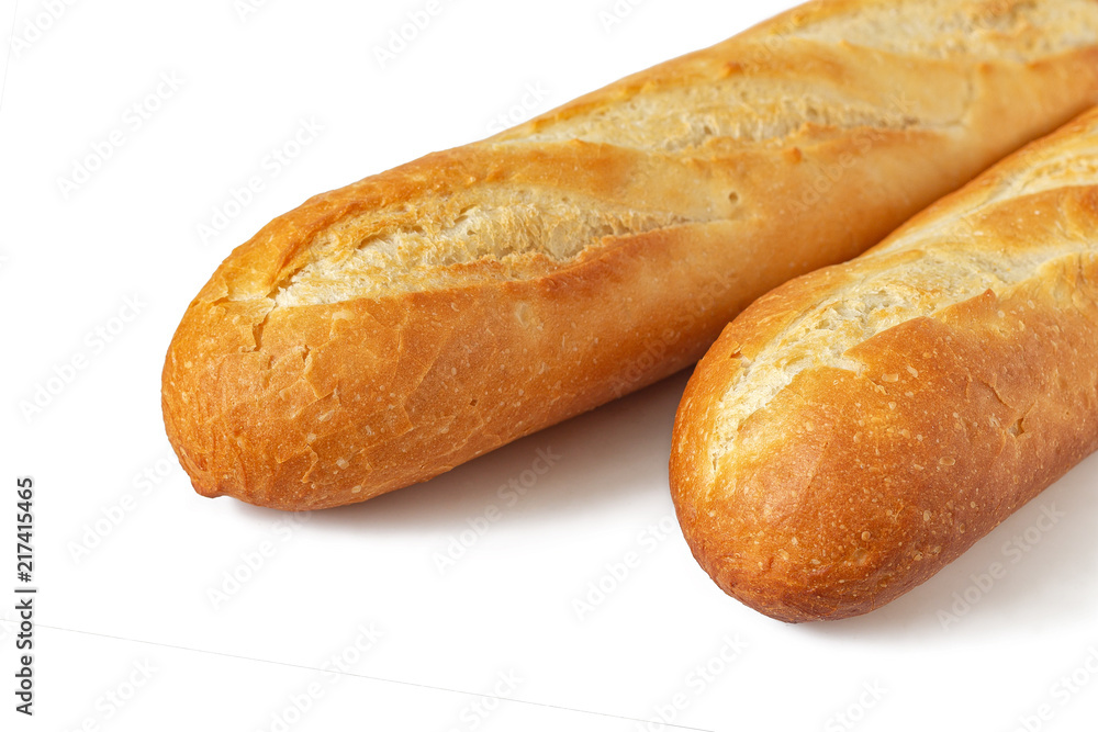 Two baguettes with a delicious crust, from a bakery, isolated on a white background. Fresh bread