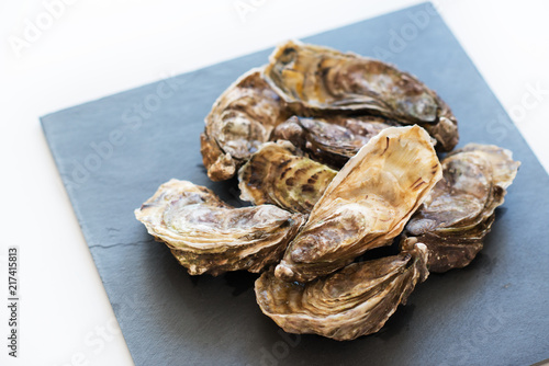 Fresh oysters, image isolated, with soft focus. Restaurant delicacy. Saltwater oysters.
