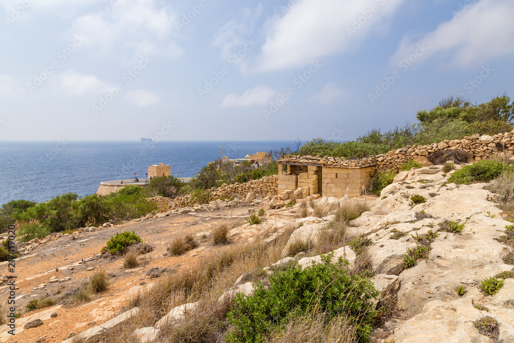 Wied Iz-Zurrieq, Malta. View of the coast. In the background, Fyllf Island