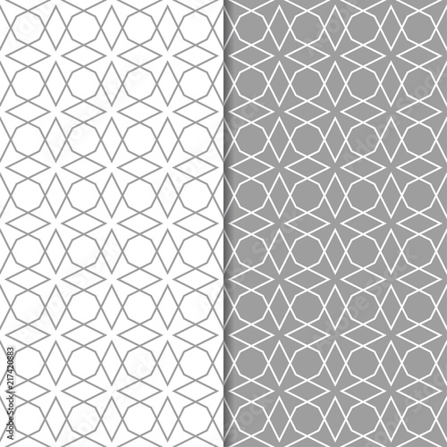 Gray and white geometric ornaments. Set of seamless patterns