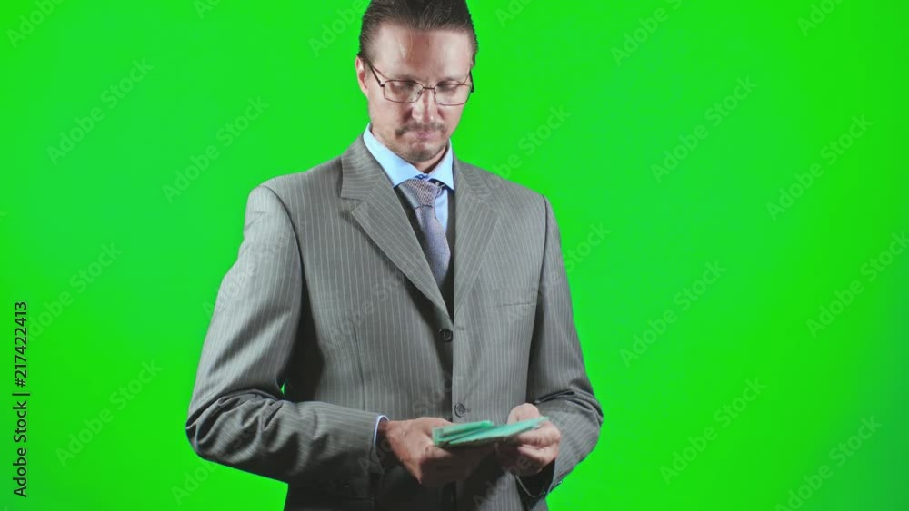 Businessman holding hundred-euro banknotes pack Businessman holding hundred-euro banknotes pack