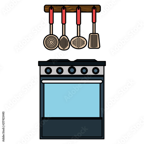 kitchen oven with cutleries hanging