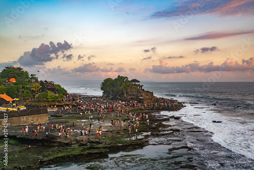 Sunset at Tanah Lot Temple on Sea in Bali Island