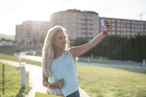 Beauty blonde woman taking self portrait photo