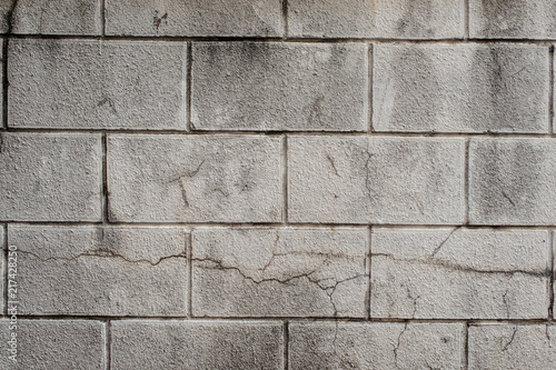 Exterior grey cinder block wall with lines of concrete photo