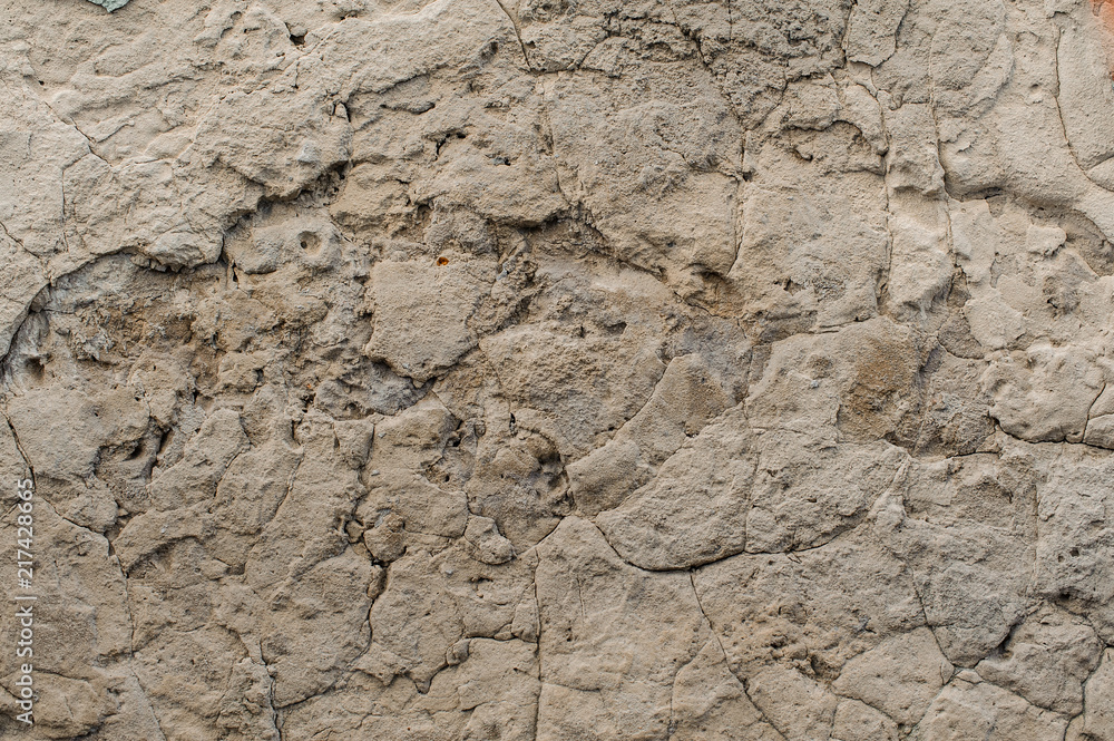 Old shabby exterior concrete wall with peeled off pieces Old shabby exterior concrete wall with peeled off pieces