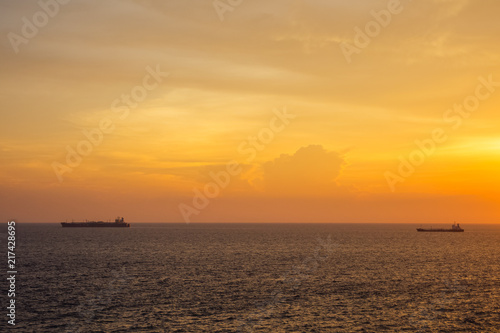Sunset at the Sea with boat and cloudy sky © mr_gateway