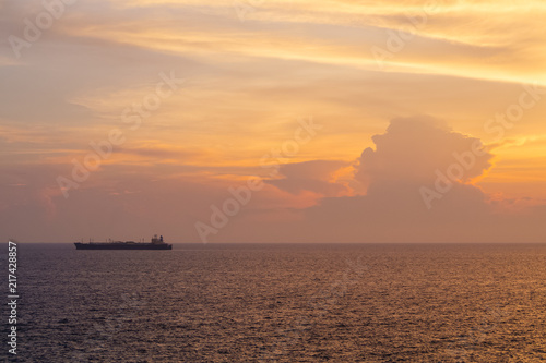 Sunset at the Sea with boat and cloudy sky © mr_gateway