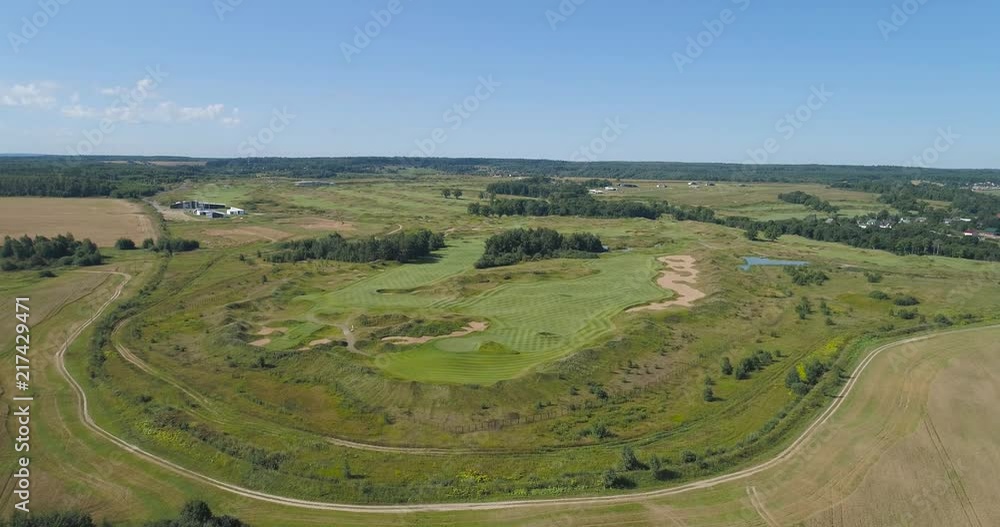 Aerial view Golf course with green grass and ponds. Golf field in the countryside. Aerial view Golf course with green grass and ponds. Golf field in the countryside.