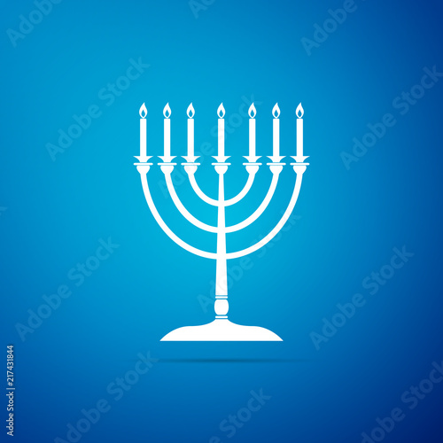 Hanukkah menorah icon isolated on blue background. Religion icon. Hanukkah traditional symbol. Holiday religion, jewish festival of Lights. Flat design. Vector Illustration