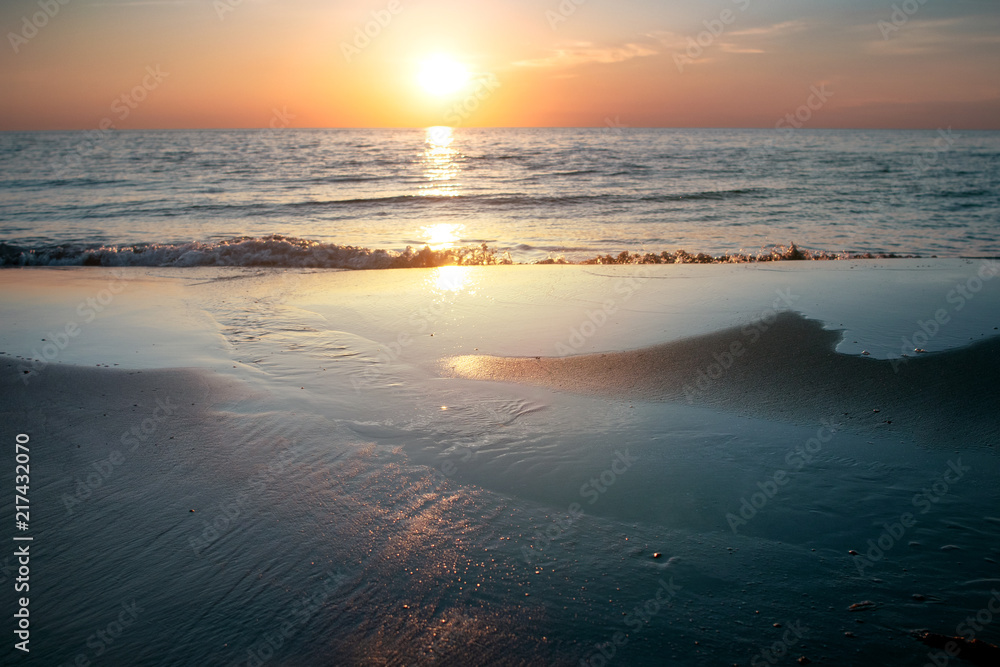 Fototapeta premium Amazing relaxing and colorful evening sunset with dramatic white clouds at a danish beach. Danish ocean sea, Lønstrup in North Jutland in Denmark, Skagerrak, North Sea