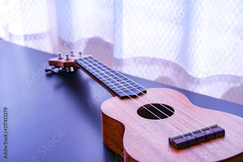 Ukulele in the natural day light by the window