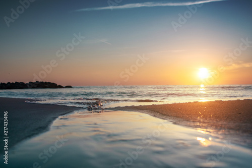 Amazing relaxing and colorful evening sunset with dramatic white clouds at a danish beach. Danish ocean sea, Lønstrup in North Jutland in Denmark, Skagerrak, North Sea