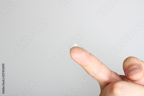 contact lens on the finger