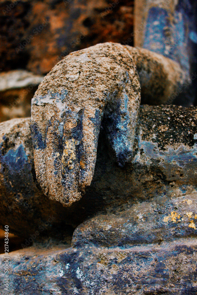 Gold hand of Buddha statue at Wat Sri Chum temple is ancient of world heritage Sukhothai Historical Park, Sukhothai province, Thailand Gold hand of Buddha statue at Wat Sri Chum temple is ancient of world heritage Sukhothai Historical Park, Sukhothai province, Thailand