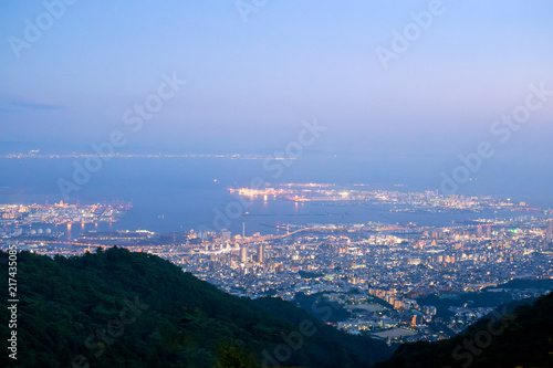 Lights from Kobe and Rokko Michi on the edge of Osaka Bay just after sunset