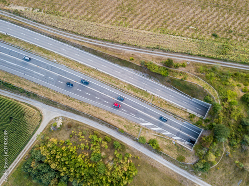 Aerial view of wildlife overpass over highway in Switzerland during sunset © Mario