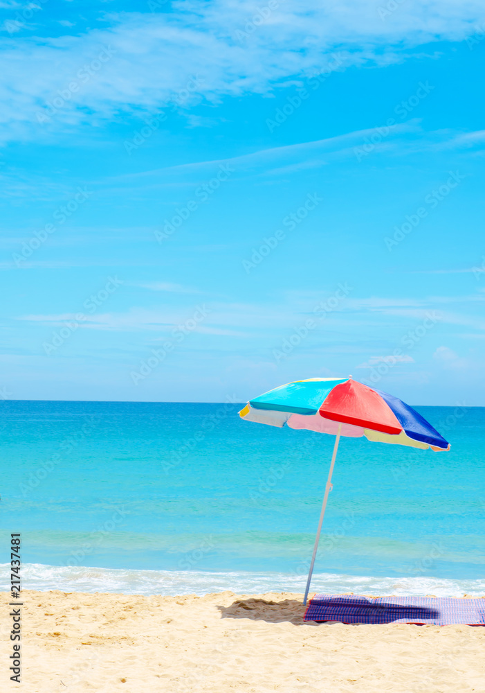 umbrella beach white sand and blue sky