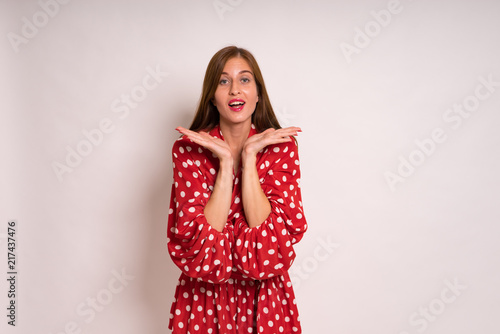 female Model Against white Studio Background in red dress