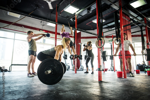 Athletes training in a cross-fit gym photo