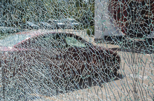 Silhouette of the car through the broken glass
