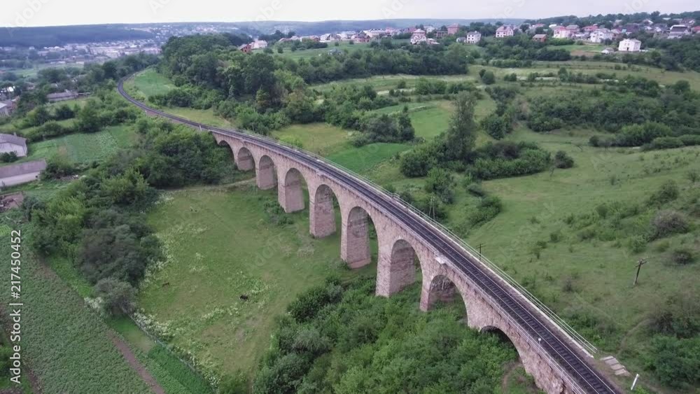 The old railroad bridge, built in the time of Austro-Hungarian Empire in Western Ukraine in Ternopil region. Aerial view. The old railroad bridge, built in the time of Austro-Hungarian Empire in Western Ukraine in Ternopil region. Aerial view.
