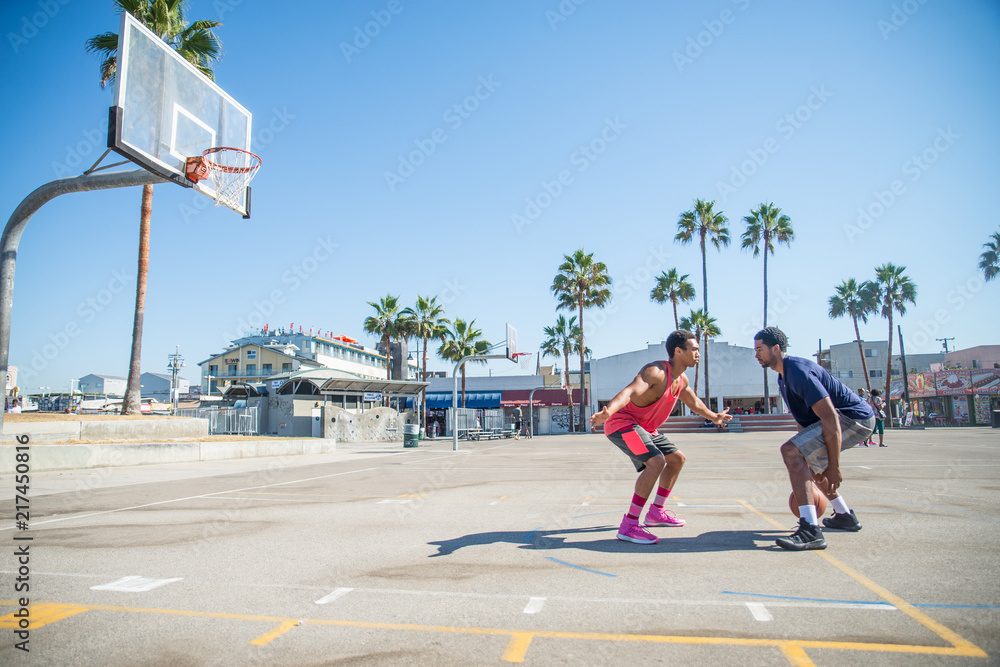 Fototapeta premium Friends playing basketball