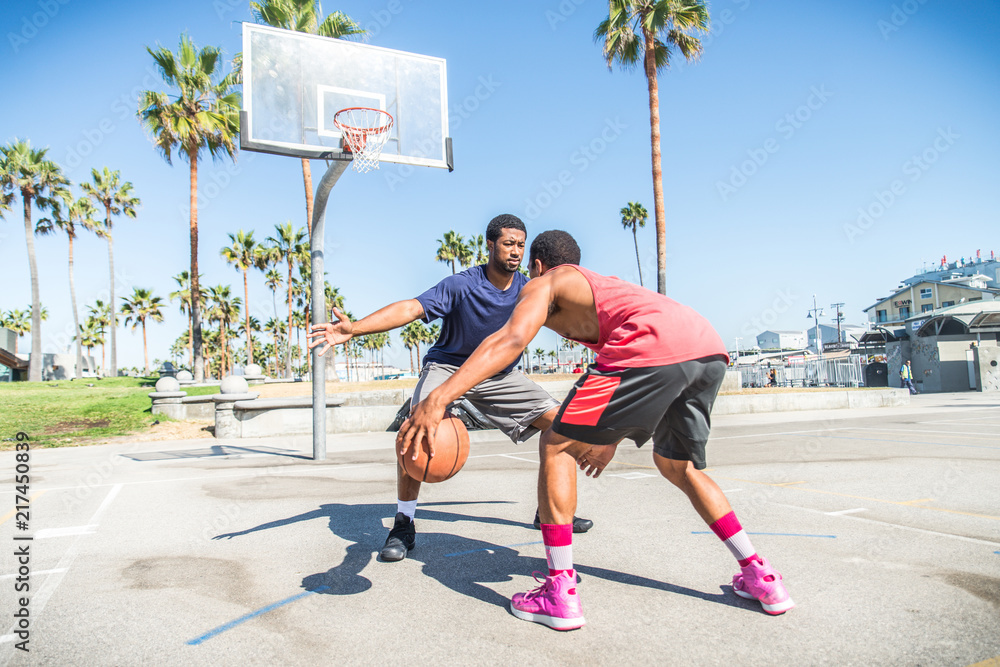 Fototapeta premium Friends playing basketball