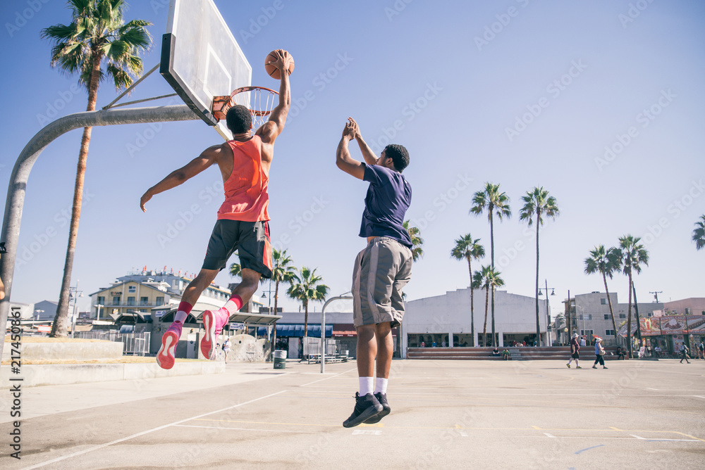 Fototapeta premium Friends playing basketball