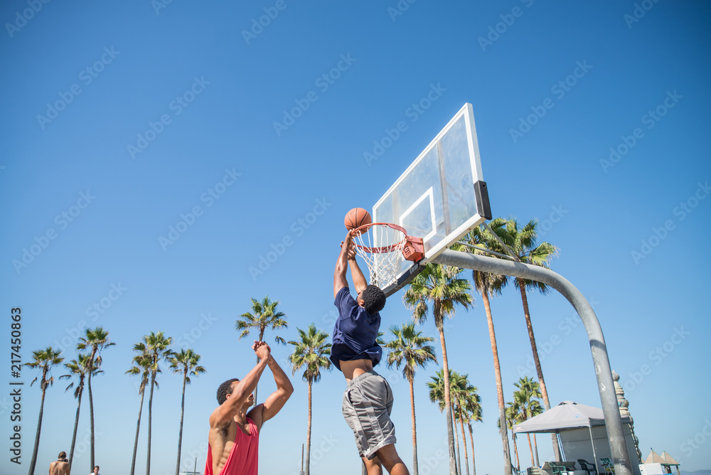 Fototapeta premium Friends playing basketball