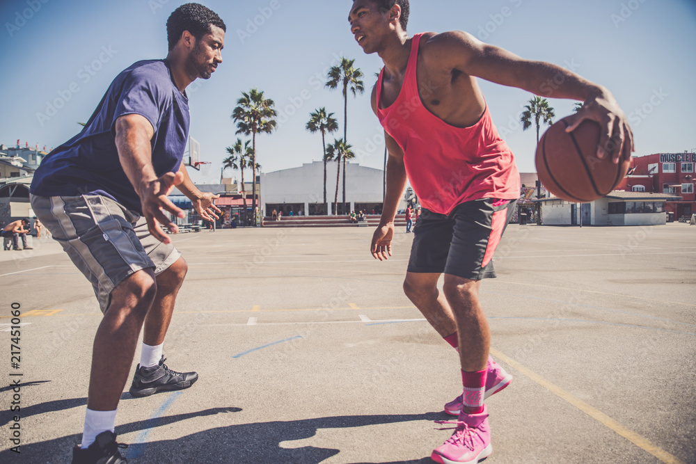 Fototapeta premium Friends playing basketball