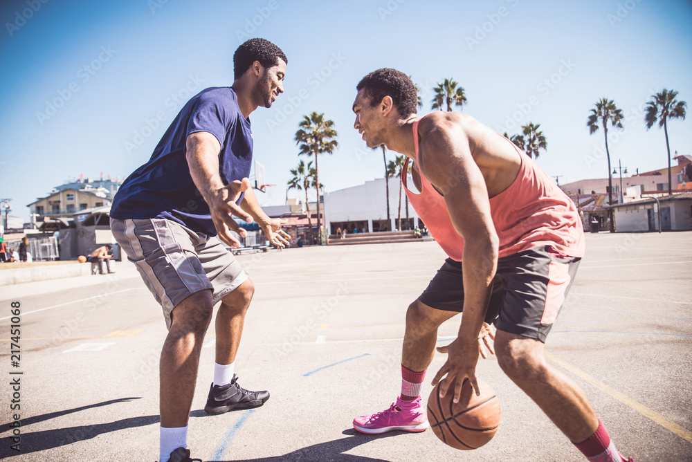 Fototapeta premium Friends playing basketball