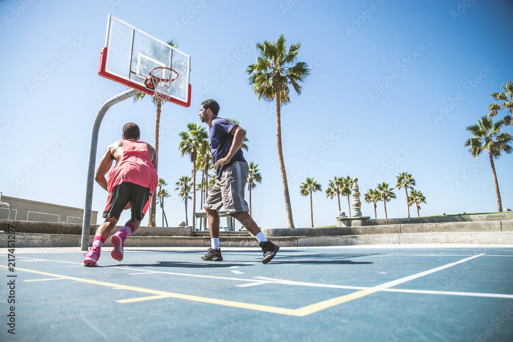 Fototapeta premium Friends playing basketball