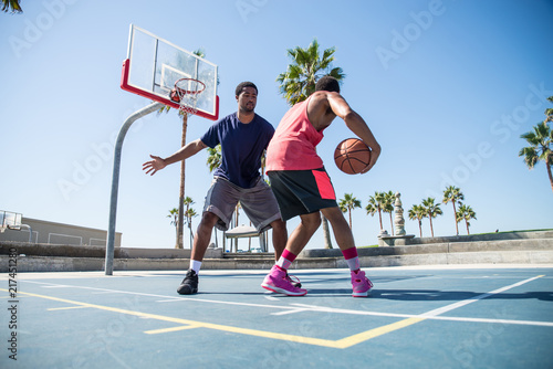 Friends playing basketball © oneinchpunch