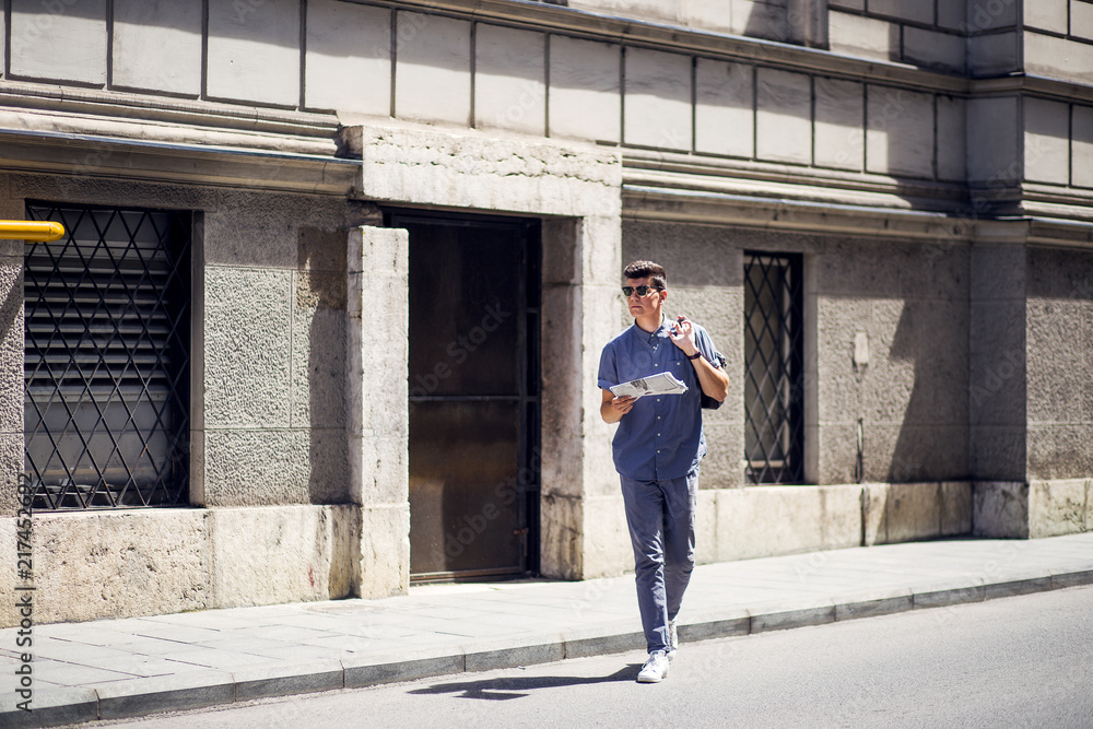 Young and modern business man crossing the street Young and modern business man crossing the street