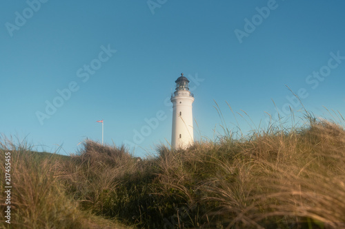 White Lighthouse, Hirtshals Fyr, with blue sky in the dunes, Hirtshals in North Jutland, Denmark