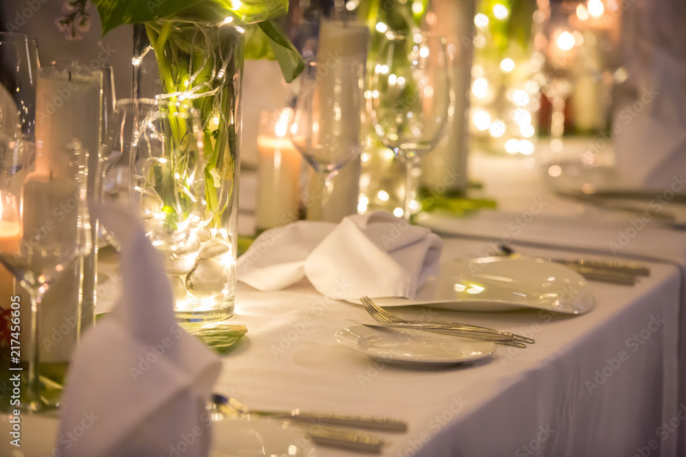 Wedding Banquet or gala dinner decorated with garlands. Festive Luxury  table set up decor for wedding, party, event Photos | Adobe Stock
