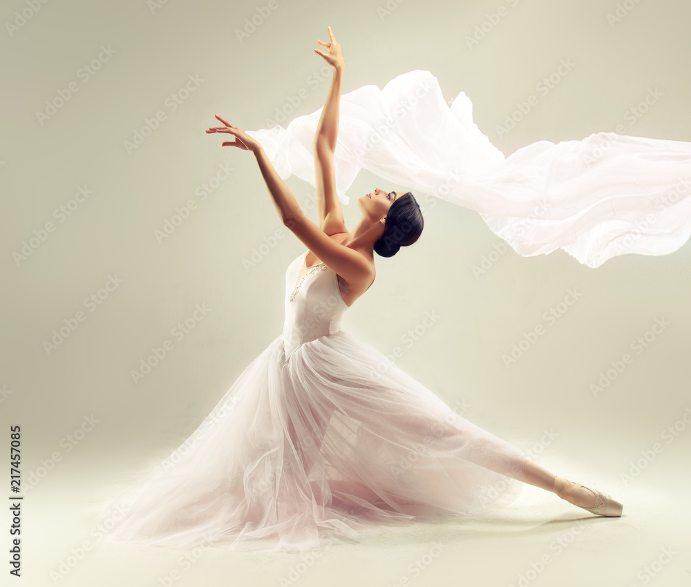     Ballerina. Young graceful woman ballet dancer, dressed in professional outfit, shoes and white weightless skirt is demonstrating dancing skill. Beauty of classic ballet. 
 - obrazy, fototapety, plakaty 