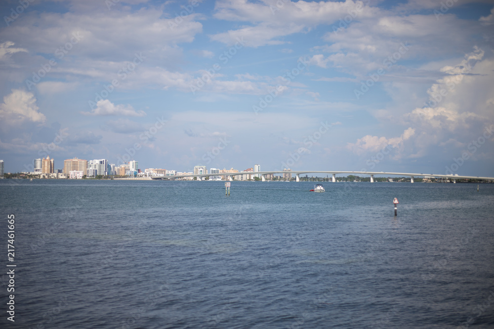 Beautiful Florida Cityscape Behind Calm Ocean Bay with Boats and Bridge