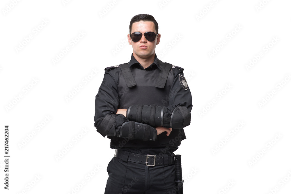 Seriuse cop in sunglasses, uniform with body armor Seriuse cop in sunglasses, uniform with body armor